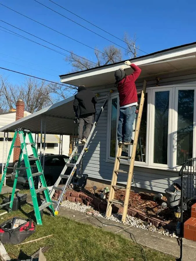 Restoration crew performing exterior repair in Gladstone