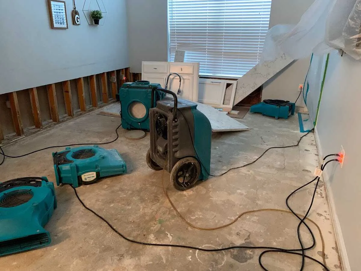 Dehumidifier in flood-cut room for Water Damage Restoration in Gladstone